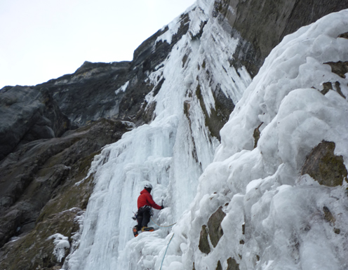 ice climber in Nemesis, a classic ice route in the Canadian Rockies